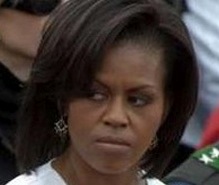 scowl - Mrs. 0bama always looks pissed.