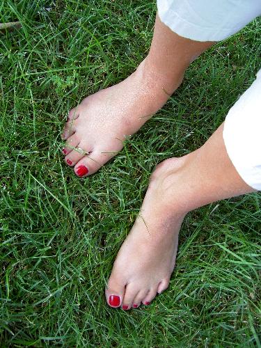 feet - bare feet with polish in grass