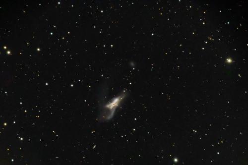 two galaxies collide -  Two galaxies in a death struggle as they collide with each other.