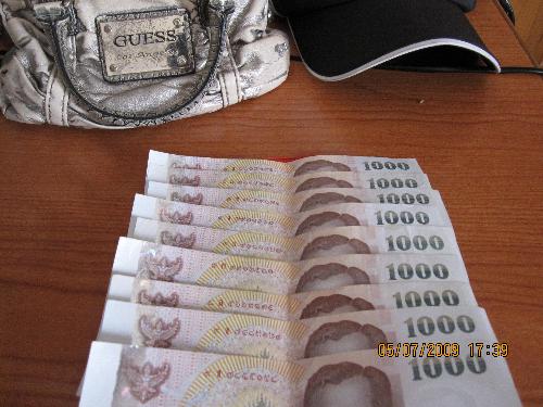 9000 - BAHT... Thailand currency. Change it to Ringgit, it will become 900, change it to USD, I am too lazy to count.