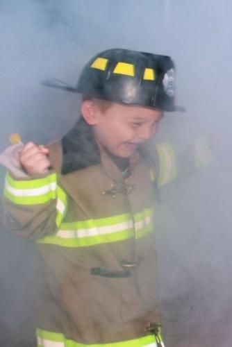 my grandson the little fire man - This is a picture of my little grandson edited with paintshop pro