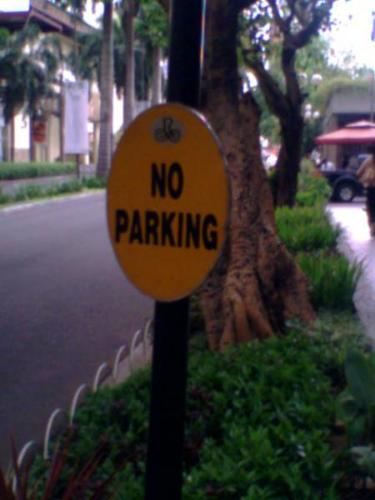 a sign taken outside - no parking
