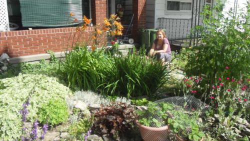 me yet again - Photo of me in my front yard, posing as a garden gnome.