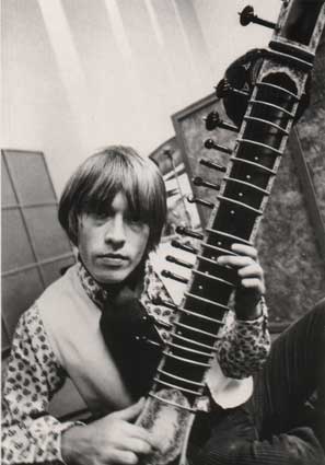 Brian Jones - Holding one of the unusual musical instruments he was famous for playing, not sure if that's a sitar or a lute or something else.