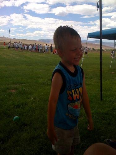 My three year old son staying cool in the sun with - My three year old son staying cool in the sun with a water bottle