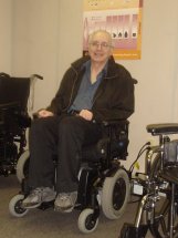 My Husband trying out a power chair - This was taken at the place where you can get power chairs, etc. These are loaned out free or charge to whomever qualifies.