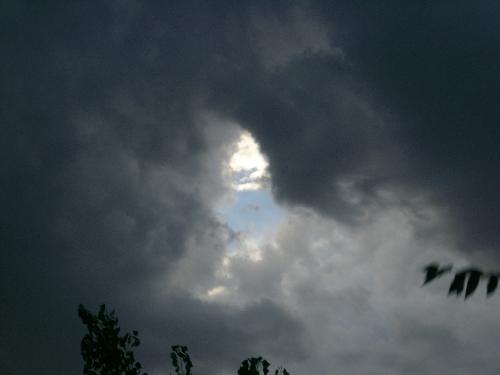 A Peephole to Heaven - This picture was taken after a storm had went by. Then the sun started to come thru the clouds and it looks like a peephole to heaven.