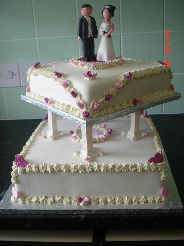 Wedding Cake - Sneak Preview - Here's a sneak preview of the cake I've just finished for my step-niece's wedding tomorrow. It's only put together temporarily and taken in my kitchen, so it doesn't look its best, but I'm quite proud of it! :)