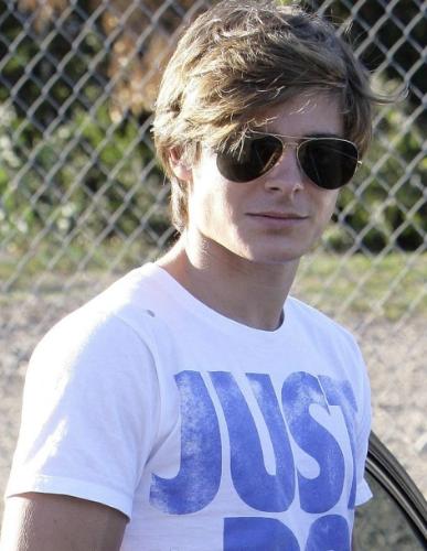 Zac Efron New Haircut - Well, it is said that Zac Efron wants to break away from his old look, and wants to establish himself to play different roles. He thinks that the new hair cut helps. Perhaps it may. Wishing Zac all the best.