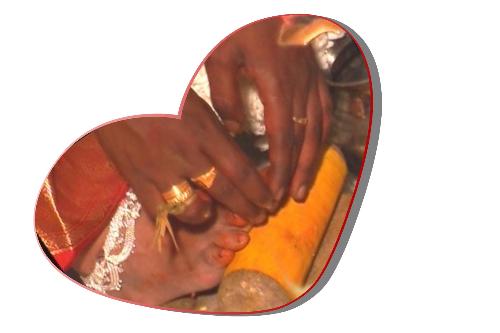 indian wedding tradition - here my husband placing the sacred, toe ring on my foot .. so lovely and touching