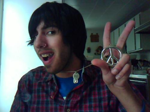 Me in My Awesome Flannel shirt!  - This is a photo of me, of course I have the peace sign up. Its all about peace, love, and happiness.  And that necklace is awesome, I wear it everyday and everywhere!