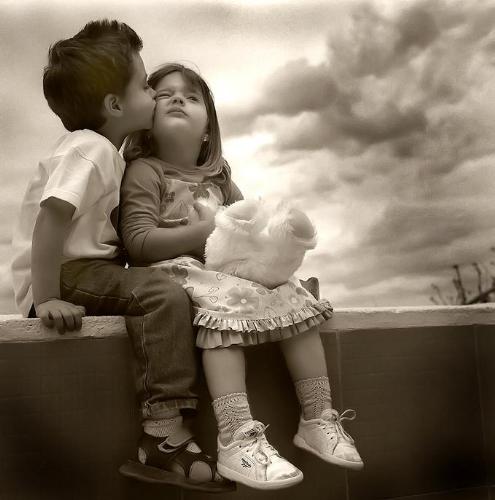 In Love - Children sitting on a wall in love