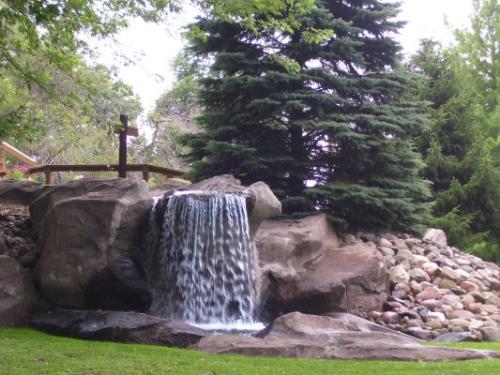 Ella W. Sharp Park Golf - Ella Sharp Park in Jackson, Michigan has 3 golf areas - this photo is of the waterfall on the 18 hole miniture golf course, there is also an 18 hole full golf courseand a learning center for practice or learning.