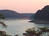 Lake Cumberland, Kentucky - Lake Cumberland in Kentucky in the late afternoon. The pink sky and sunset are just beautiful behind those hills.