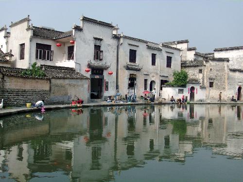 an old small in China  - It is a very famous site in China, and I visited there last year. The building have been built for more than 500 years and there are still people live there. It is typicall Chinese style, and looks very beautiful. Oh, this place called Hong villege in Anhui Province, China. 