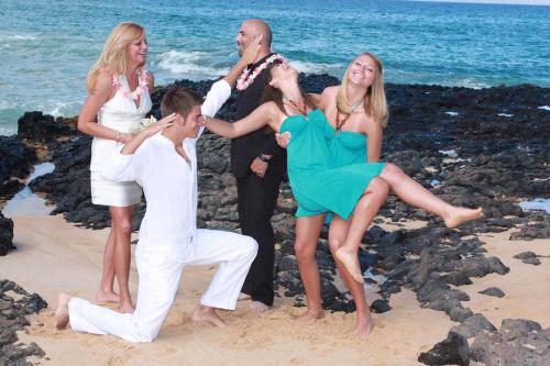 Blended Family - The woman laughing is my first cousin Demyree (pronounced Deemarie), and the man in black is her new husband Matt. The guy in the sand showing off is my second cousin Garron, Demyree's son by her first marriage. Jasmine, the girl holding the other girl is also Demyree's daughter, again by her first marriage. The girl being held by Jasmine is Matt's daughter Melissa, from his first marriage. This is the second marriage for both. They flew to Hawaii, just them for their wedding. Blended Family - The woman laughing is my first cousin Demyree (pronounced Deemarie), and the man in black is her new husband Matt. The guy in the sand showing off is my second cousin Garron, Demyree's son by her first marriage. Jasmine, the girl holding the other girl is also Demyree's daughter, again by her first marriage. The girl being held by Jasmine is Matt's daughter Melissa, from his first marriage. This is the second marriage for both. They flew to Hawaii, just them for their wedding.