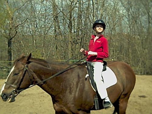 riding a horse - My old horse, Gamester. He is an American Quarter Horse. He was a retired race horse. That's me riding him when I was like 10 or so.