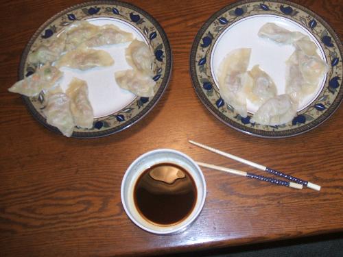 Potstickers - Chinese dumplings and some sauce.