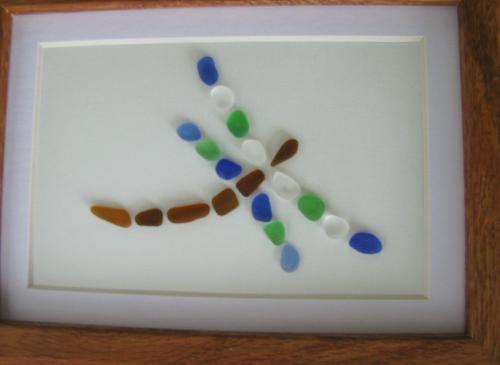 Sea Glass Dragonfly - Authentic sea glass has been used to make this image of a dragonfly. This particular creation sits inside a 5 x 7 picture frame.