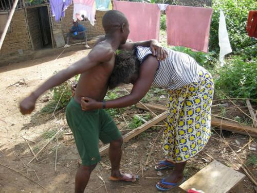 A husband is beating his wife. - In Africa husbands often beat their wives.In Asian countries also wives are beaten by their husbands.In Europe,America and other white countries law prevented to beat wives.In these countries if husband beat their wives they get punishment.