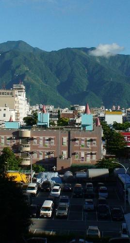 hualien city northern mountain  - northern mountain of hualien city, including castle-like child care center and parking lot below, and the only KFC branch in the city.