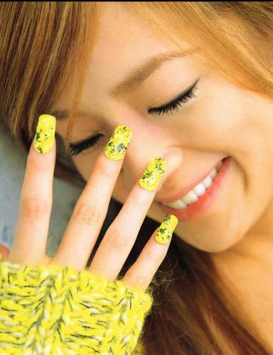 fashion - this picture is very fashionable..i love the way the girl has matched her nailpaint with her dress..i think she really looks very pretty