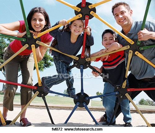 Mom and children outdoors flying a kite - Mom playing with his children