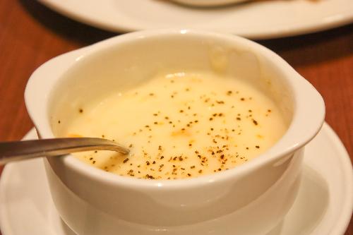 Soup - This is a picture taken at a restaurant. It shows a bowl of mushroom soup sprinkled with pepper. This picture can be used for discussion where food is concerned.