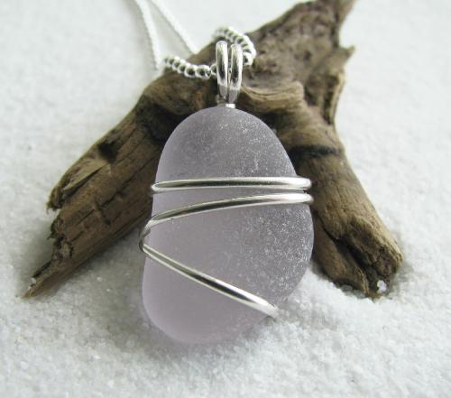 Lavender Sea Glass Necklace - This soft lavender sea glass gem is wrapped in sterling silver wire and hangs on an 18' ball style sterling silver chain. The sea glass measures just over 3/4'L.