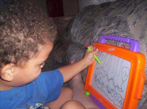 My youngest grandson and his drawing - My youngest grandson and his magnetic drawing board with the drawing he did.