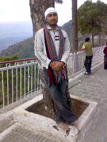 Manjit - In front of tree