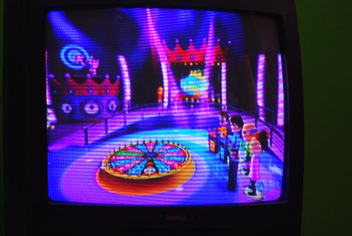 TV Show King Party - playing trivia video game on the Wii