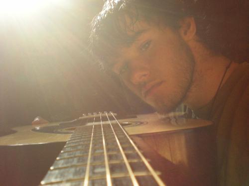 The sun, mi guitar, and I - A picture I took with the sun behind me while holding my guitar. There is no photoshop by the way, thatk you very much