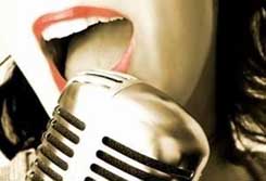 Microphone - Girl singing into a microphone