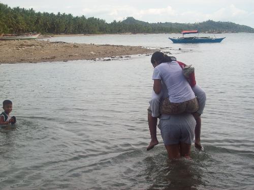 piggyback ride - helping someone cross the river so she doesn't get wet is kind of cool