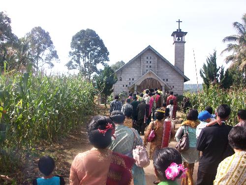 going to church - In Asia (Indonesia), people are going to church.