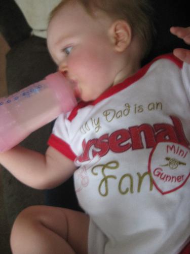 my daughter - a picture of my daughter in her Arsenal baby clothes which was taken on Wednesday ready to watch the game with Celtic