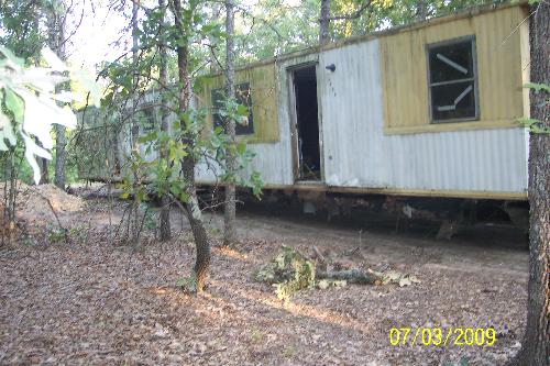Pulling it on the land - This is a picture of the mobile home, when they were moving it onto the land.