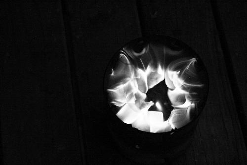 Bum Candle - This is how I cook. This is my homemade stove.  A little background: I am currently homeless and traveling. I am unable to afford a real stove, so I made one. It's an aluminum can with cardboard spiraled inside of it and then candle wax melted into it.  The Bum Candle is lightweight, portable and inexpensive, thus making it a perfect tool for any street kid, traveler, budget backpacker or homeless person.