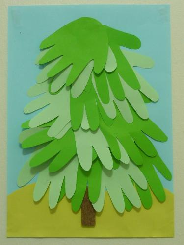 Hand Print Tree - Using the outline of our palm, cut out green 'leaves' for the tree. This makes a beautiful pine tree indeed.