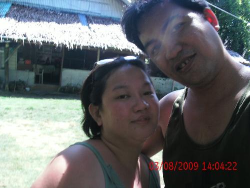 me and my hubby - a pic of me and my hubby at the backyard of his aunt's house.