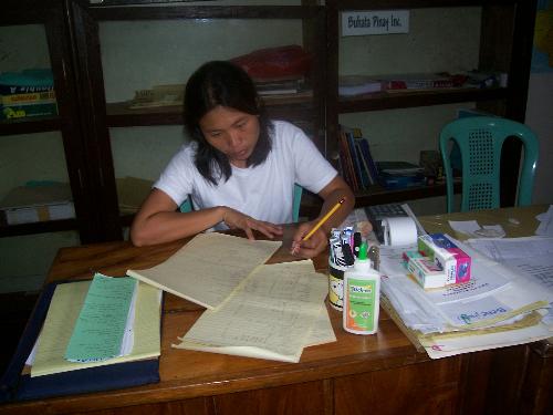 office work - working at desk in an office. so many paper works to finish.