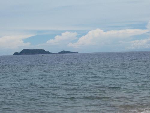 Apo Island - Apo Island shaped like a turtle as viewed from Negros Oriental island, Philippines