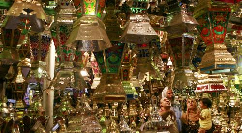 Happy Ramadhan - An Egyptian family looks to buy a 'Fanus Ramadan', a traditional lantern popular during Ramadan, at a shop in el-Sayeda Zaynab district of downtown Cairo, late August 28, 2008. (KHALED DESOUKI/AFP/Getty Images)
