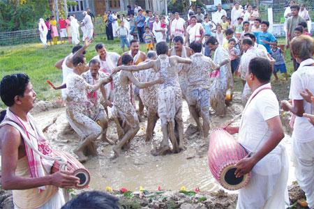people playing - People playing with clay in Assam(India)as a part of a religious festival...