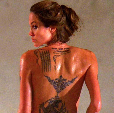 Angelina Jolie - Showing off some of her 'ink'