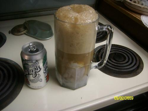 giant root beer float - the root beer float next to a can