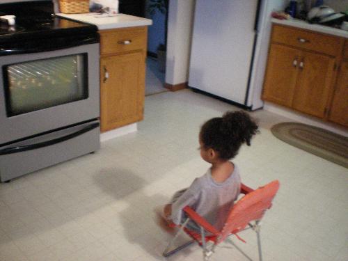 Cookie Watcher - 2yr. old watching an patiently waiting for her chocolate cookies to be done.