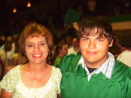 relationship - mother and son at high school graduation