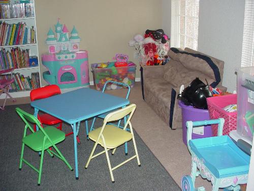Daycare Play Area - This is a daycare play area full of toys, books, movies, and other child related materials.